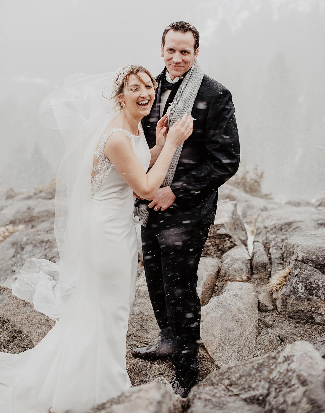 Couple eloping in the snow above Lake Tahoe
